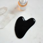 black ink on white surface near bottle