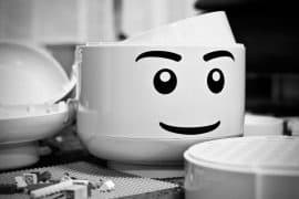 grayscale photography of LEGO piece plastic toy