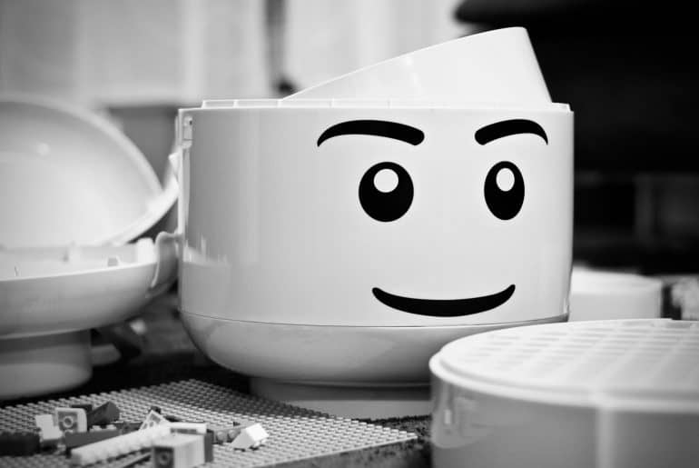 grayscale photography of LEGO piece plastic toy