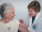 woman inject a woman on left shoulder